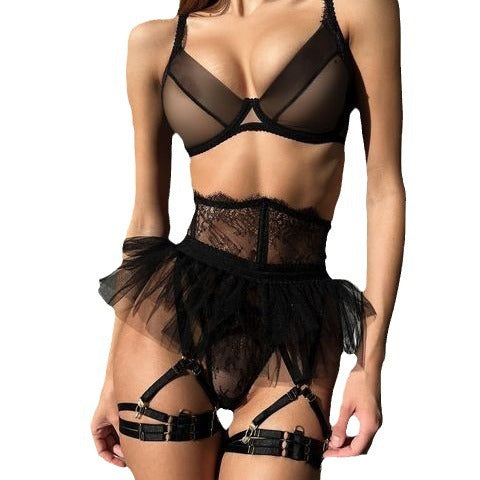 Ensemble de lingerie sexy transparent 4 pièces avec jupe tutu, string et tanga.